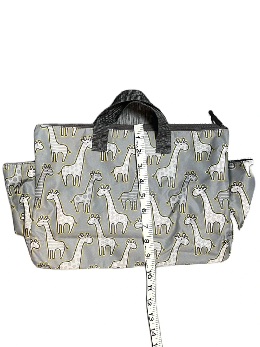 Thirty-One Zip-Top Tote in the Go Go Giraffe print with seven pockets